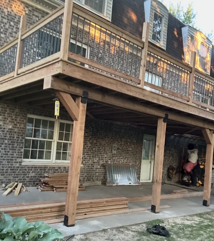 Wood deck showing support posts and railings