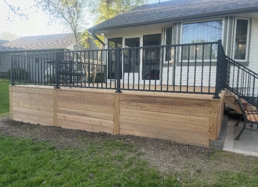 Wide view of wood deck and black railing details