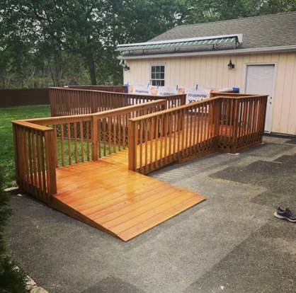 Wood access ramp with matching guardrails and landing