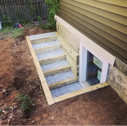 Outdoor steps bordered by timber landscaping