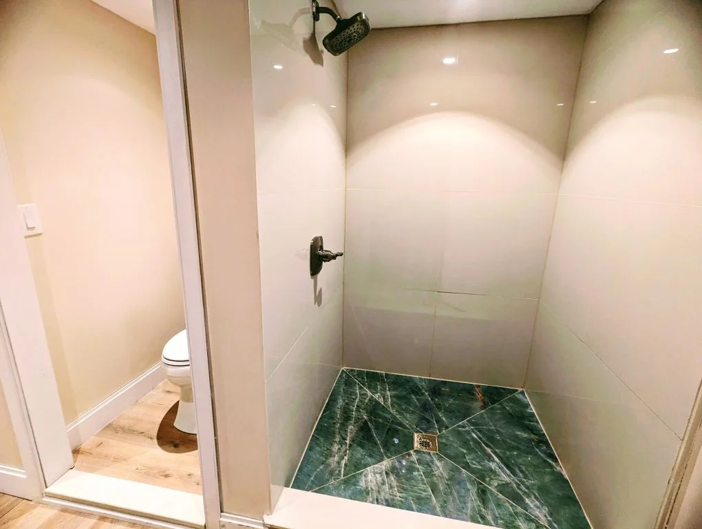 Walk-in shower interior during renovation